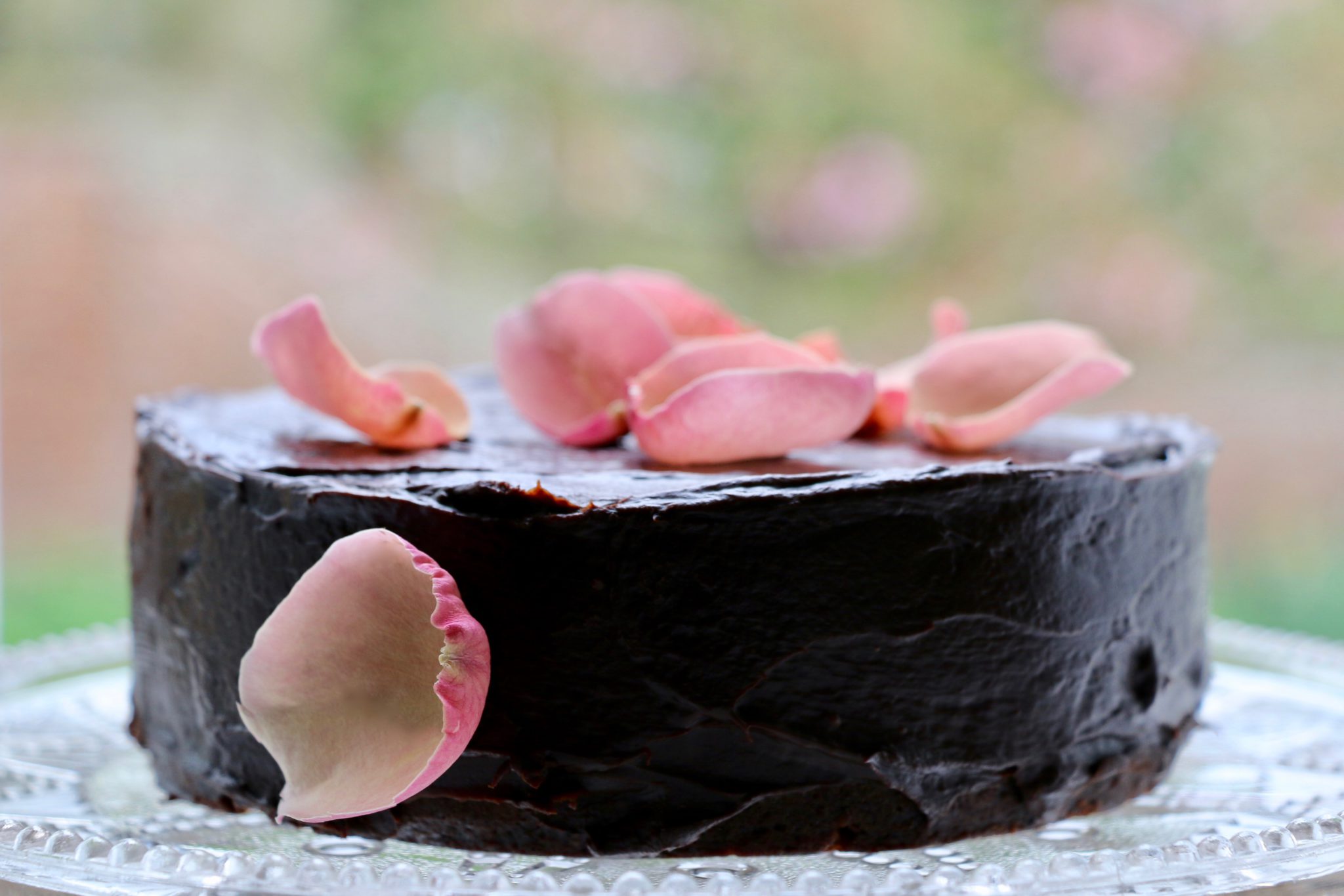 Edible flower cake with sweet geranium, blackcurrant & vanilla